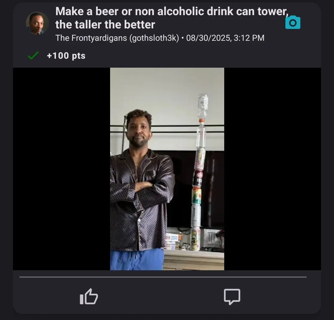 A man completing a challenge to stack the tallest drink can tower, his tower is 7 cans tall