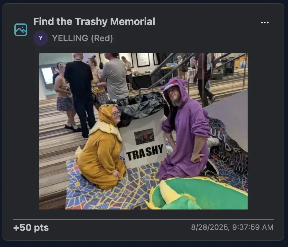 Two players crouching dramatically at the Trashy Memorial, dressed in colorful animal onesies.